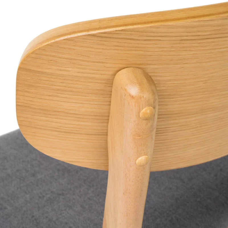 Silla de comedor tapizada de estilo moderno de mediados de siglo con patas de madera de caucho